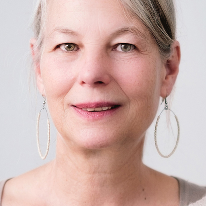 Older Woman With Dry Eyes and Hoop Earrings.