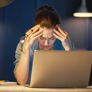 Woman With Eye Strain On Laptop.