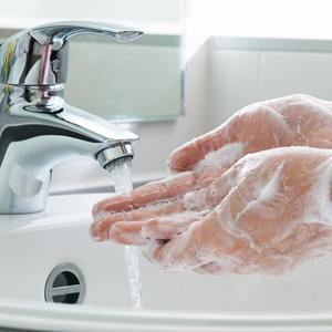 Washing Soapy Hands In The Sink.